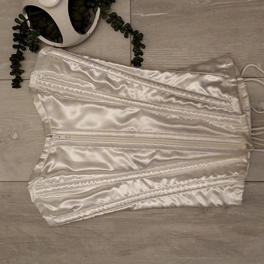 Corset top in white. Zipper front tie back Size 2
